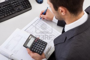 14929635-successful-accountant-working-with-financial-data-in-the-office